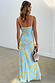 Blue Fawn Poppy Elsie Dress from the back, featuring yellow straps and a poppy and fawn spot print.