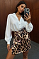 Iconic Leopard Mini Jaspre Skirt with a wrap tie fastening, paired with a white shirt for a mirror selfie.
