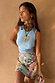 Ice Blue Ribbed Tank Top styled with a colourful beaded star skirt, shown on a 5ft4– model wearing size S.