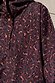 Dark Leopard Rain Mac detail featuring a waterproof leopard print and front button fastening.