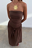 Thumbnail for Chocolate Lola Mid-axi Dress featuring a ruched bodice and full skirt, styled strapless with a gold sun pendant.