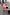 Thumbnail for Kids Red and Pink Bandana Knitted Set on a child walking a dog in a matching bandana print dog jumper.