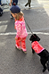 Kids Red and Pink Bandana Knitted Set on a child walking a dog in a matching bandana print dog jumper.