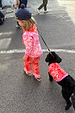 Kids Red and Pink Bandana Knitted Set on a child walking a dog in a matching bandana print dog jumper.