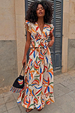 Banana Kerri Top with a colourful banana print and tie front, styled as a co-ord with a matching tiered maxi skirt.