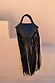 Black Leather Fringe Bag with a plaited handle and long fringe, a versatile statement staple.