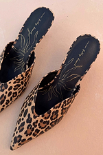 Leopard Heel Mules in a classic animal print with a pointed toe and gold logo detailing on black insoles.