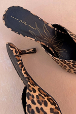 Leopard print leather mules with a 5.5cm heel, gold sun graphic and Never Fully Dressed logo on the inner sole.