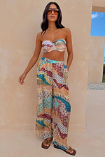 Multi-colour wide-leg Morocco Trousers in a celestial patchwork print with an elasticated waistband.