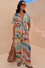 Morocco wide leg trousers in a celestial patchwork print, styled as a co-ord with a matching tie-front top.
