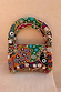 Morocco Beaded Bag featuring abstract hand-beaded patterns in autumnal tones and a matching beaded top handle.