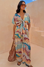 Morocco Tie Front Top in a blue and rust patchwork celestial print, styled as a multi-wear vacation co-ord.