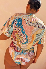Morocco Tie Front Top in a patchwork celestial print with blue and rust tones, shown from the back.