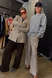 Grey Check Trousers styled with a sweatshirt and leopard print heels for a smart casual London look.