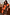Thumbnail for Poppy Leopard shorts and matching sweatshirt with vibrant orange floral prints on a curve model.