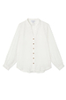 Oversized white Miley shirt featuring blouson sleeves and contrast tortoise buttons in a luxe, lightweight fabric.