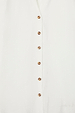 White Miley Shirt featuring contrast tortoise buttons on lightweight, slightly sheer fabric.