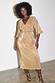 Gold plisse midi dress featuring shimmering angel sleeves and a belted waist on a smiling model.