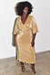 Gold Plisse Dress featuring shimmering retro angel sleeves and a tie waist on a model, ideal for dopamine dressing.