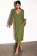 Khaki Celia plisse midi dress with long sheer sleeves and a v-neck, paired with blue embellished heels.