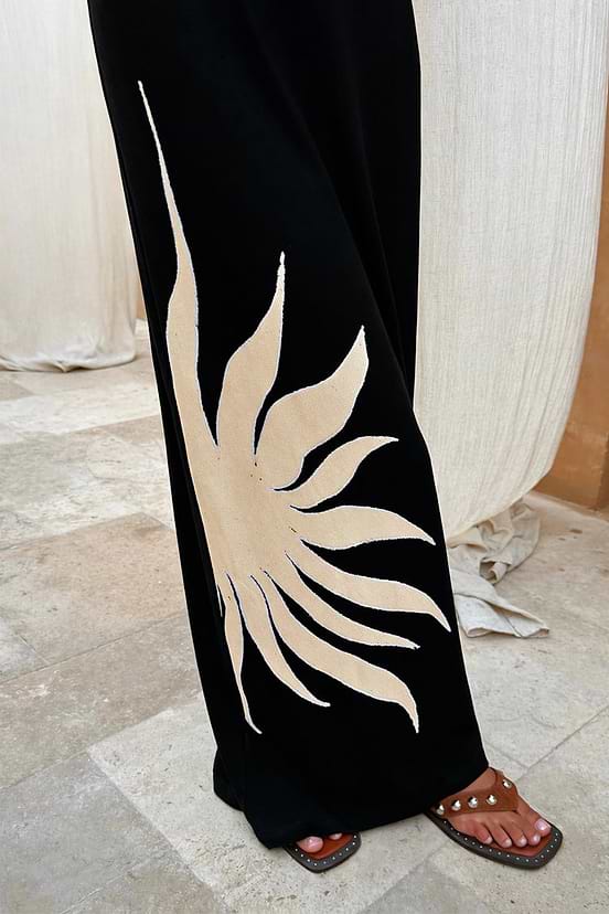 Black Sol Dorris Skirt with a cream hand-painted sun print on slinky black viscose-stretch jersey.