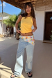 Lemon Ribbed Tank in yellow soft stretch fabric, styled with wide-leg jeans and a colourful scarf.