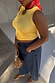 Lemon Ribbed Tank in yellow stretch rib fabric styled with dark studded jeans and a red patterned neck scarf.