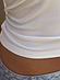 Thumbnail for White Teddy T-Shirt detail highlighting the ribbed viscose fabric and hemline against light-wash denim.