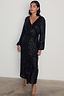 Thumbnail for Black Sequin Kira Wrap Dress with long sleeves and midi length, styled with strappy leopard print heels.