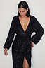 Thumbnail for Black Sequin Kira Wrap Dress with a deep V-neckline and long sleeves, showcasing the multi-wear wrap style.