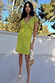 Green Shell Mini Elodie Dress in lime featuring a contrast crochet bodice and satin skirt.