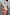 Thumbnail for Pink Hearts Dorris midaxi skirt with gold-bordered red heart motifs, styled with a white t-shirt. Model is 5ft6, size 8.