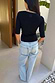Black Teddy T-Shirt with mesh neckline and back detail, styled with light wash Scallop Jeans.