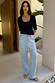 Thumbnail for Black Teddy T-Shirt featuring a mesh scoop neckline and elbow-length sleeves, styled with light-wash jeans.