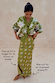 Khaki Eye Dorris Skirt and matching cardigan with eye motifs, shown in size 10 on a size 6 model for a longer fit.