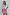 Thumbnail for Pink Vegan Leather Mini Jaspre Skirt styled with a white button-down shirt and sunglasses.