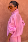 NFD Pink Organza Funnel Jacket in sheer fabric with a statement high collar, shown in profile on a model.