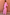 Thumbnail for Sheer Pink Organza Funnel Jacket and matching maxi skirt styled against a textured terracotta wall.