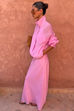 Sheer Pink Organza Funnel Jacket and matching maxi skirt styled against a textured terracotta wall.