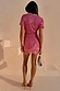 Pink Sequin Mini Maeva Skirt with a lace trim border, styled with a matching sequin top and gold heels.