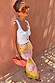 Pink Fawn Poppy Maeva Petite Midi Skirt featuring yellow floral motifs and a contrast lace hem.