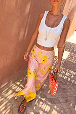 Pink Fawn Poppy Midi Maeva Skirt featuring yellow poppy motifs and a contrast lace border, styled with a white tank.