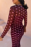 Thumbnail for Burgundy Polka Dot Mesh Dress in sheer fabric with pink spots, styled with a leopard print clutch.