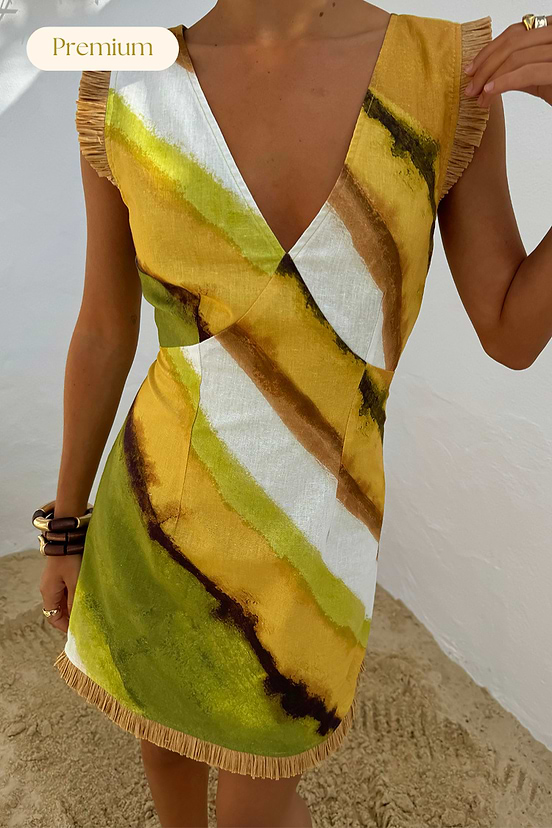 Green Ombre Deia mini dress with earthy green and yellow diagonal stripes and textured raffia trim.
