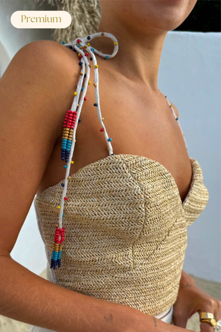 Premium beige Raffia Cecilia Top with corset structure and multicoloured beaded multi-wear straps.