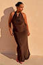 Chocolate Sabine Dress featuring a draped cowl halter neck and soft maxi silhouette on a model against a sunlit wall.