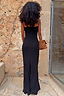 Thumbnail for Black Sapna petite maxi dress shown from the back with adjustable straps and a leopard print clutch bag.