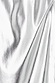 Close-up of metallic silver vegan leather fabric on the iconic Jaspre wrap skirt.