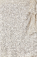 Close-up of silver sequins on the iconic Mini Jaspre wrap skirt.