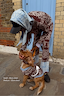 Thumbnail for Chocolate Bandana Dog Jumper in a brown and blue knit, worn by a dog with matching bandana print knitwear.